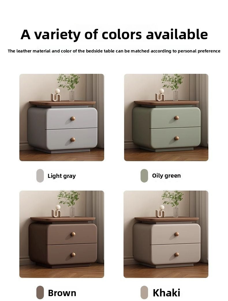 Soft upholstered nightstand with rounded edges beside a modern bed frame