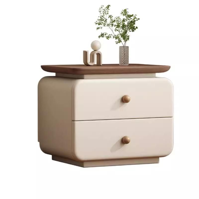 Soft upholstered nightstand with rounded profile and wood drawer