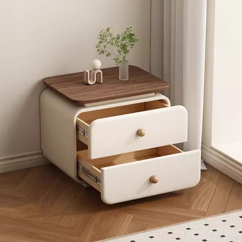 Beige upholstered nightstand with solid wood drawer detail