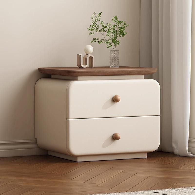 Modern upholstered bedside cabinet with warm wood drawer accent