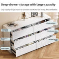 Tall cream dresser with multiple drawers in a modern bedroom