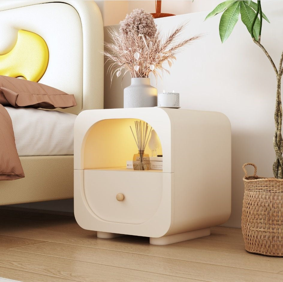 Cream nightstand designed for small bedrooms and guest room storage