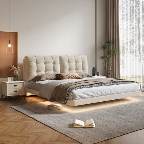 Cream floating storage bed with upholstered frame in a modern bedroom