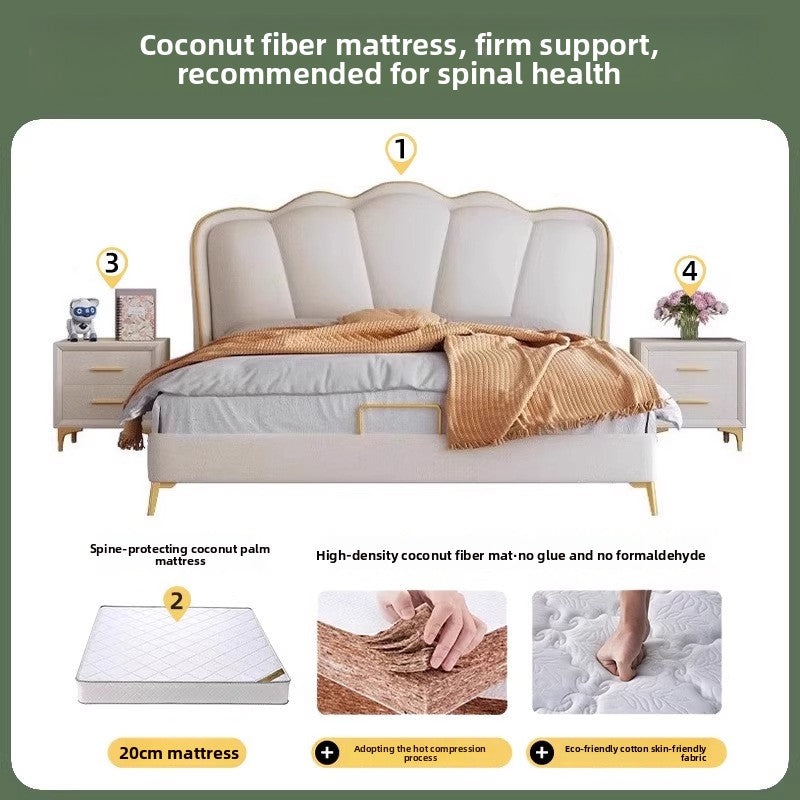Neutral upholstered bed styled with layered textiles and warm lighting