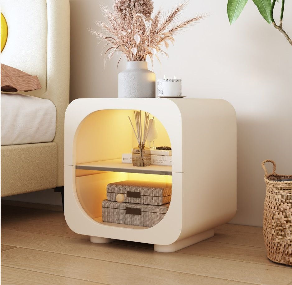 Rounded cream bedside cabinet with concealed drawer storage and calm styling