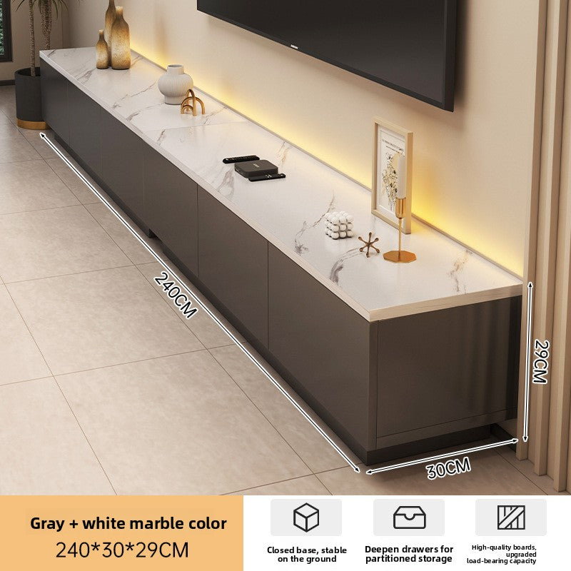 Low-profile cream TV stand styled under a wall-mounted television