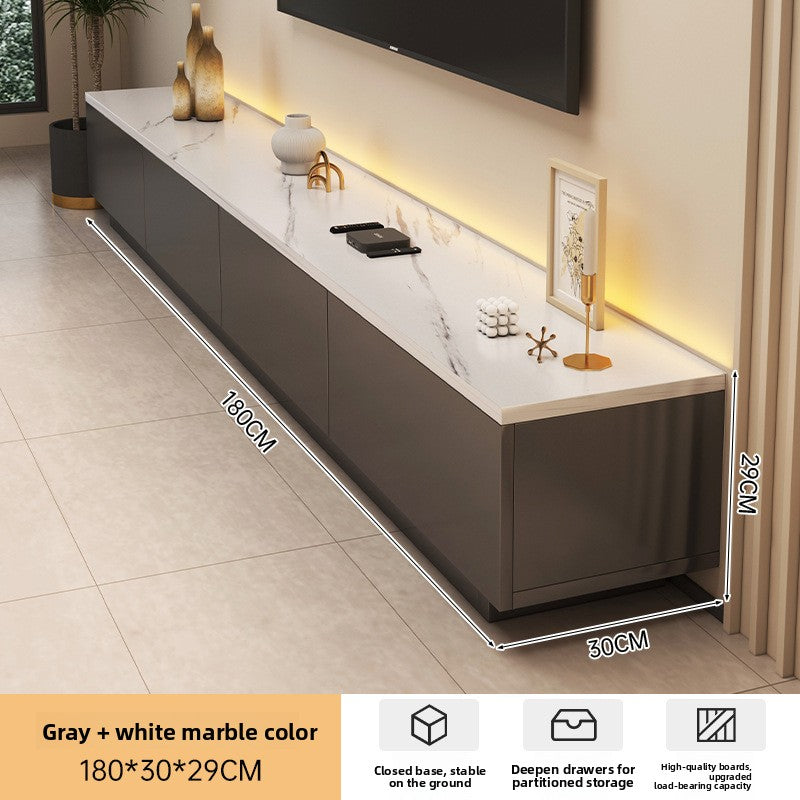 Minimal cream entertainment unit with a soft low-slung silhouette