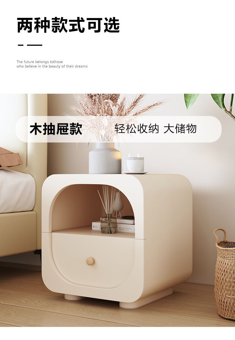 Cream nightstand styled in a calm neutral room with simple bedding