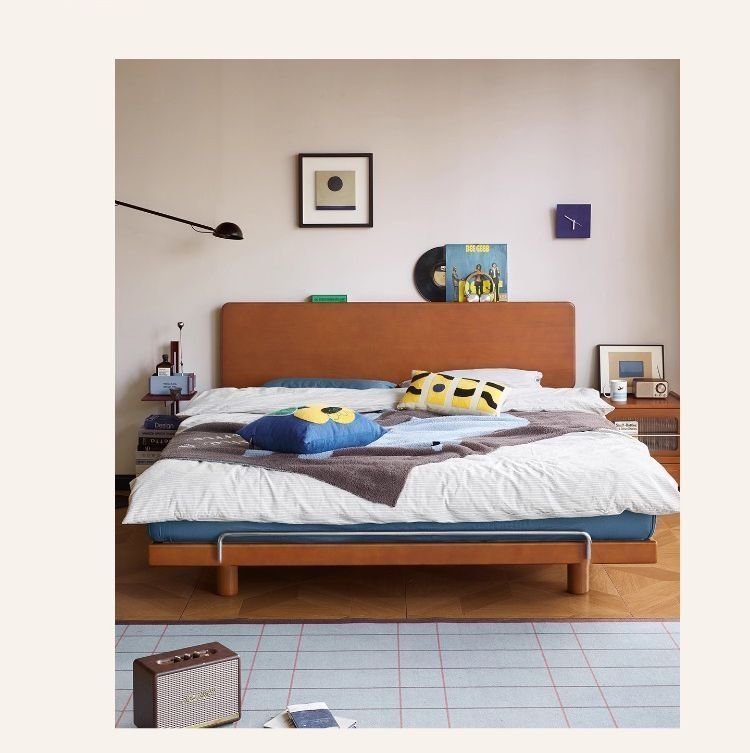 Warm wood bed frame with clean lines and calm neutral styling