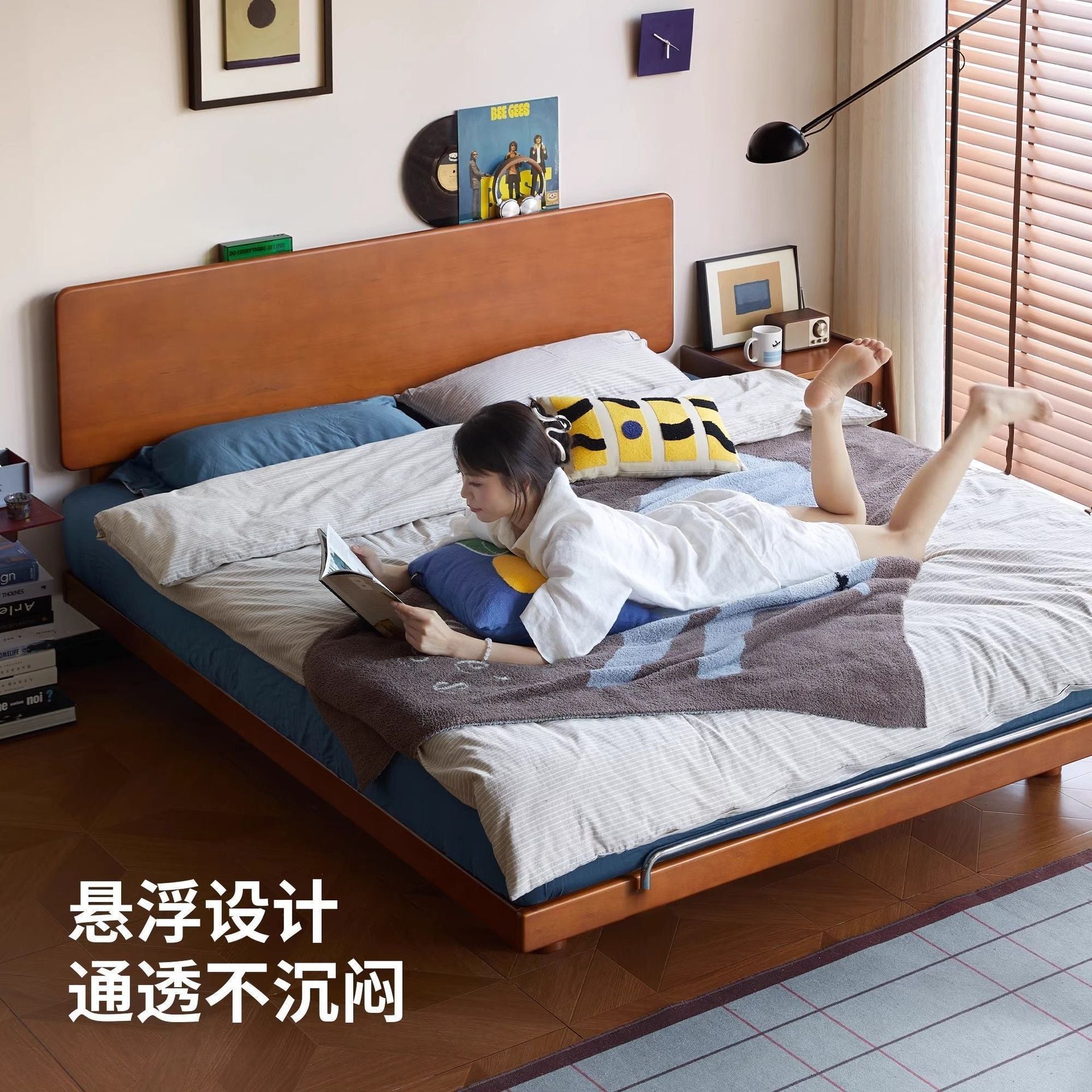 Warm wood platform bed with soft headboard styling in a neutral room