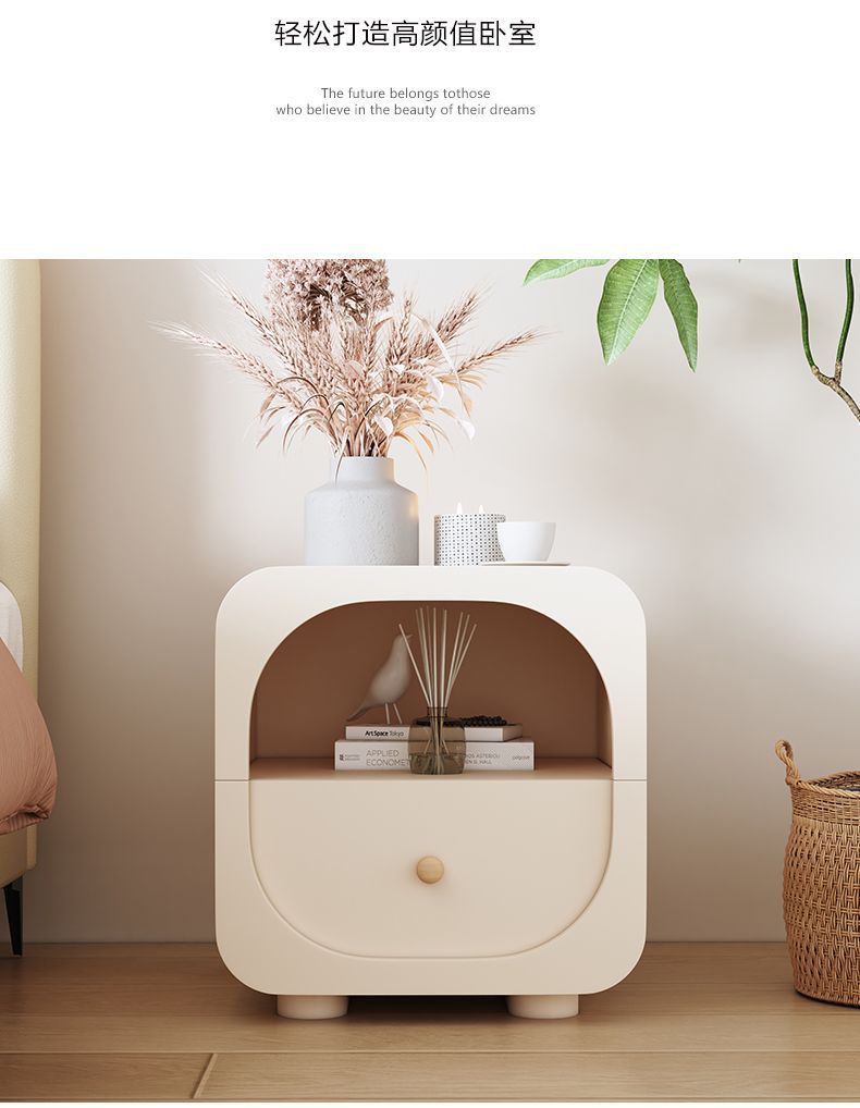 Cream bedside storage table with rounded profile and soft modern styling
