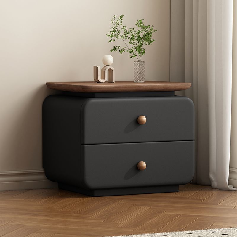 Upholstered bedside table in a soft neutral bedroom setting