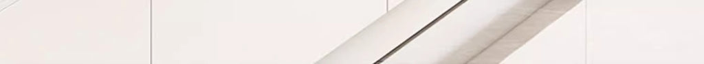 Warm gray low TV stand with smooth curves and soft neutral styling