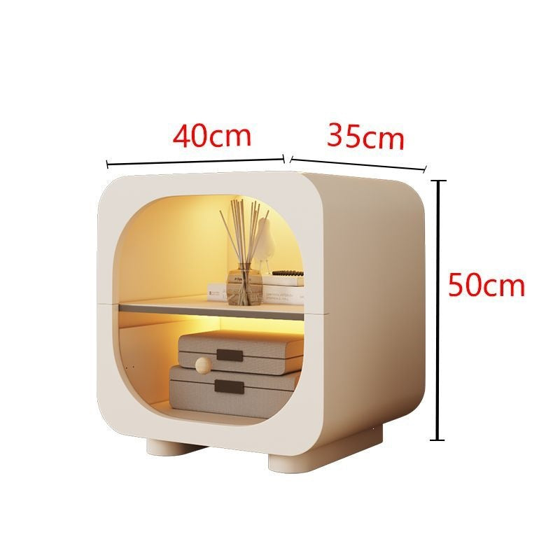 Cream bedside table with soft rounded shape and drawer storage