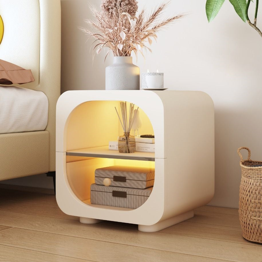 Small cream nightstand with clean curves and concealed drawer storage