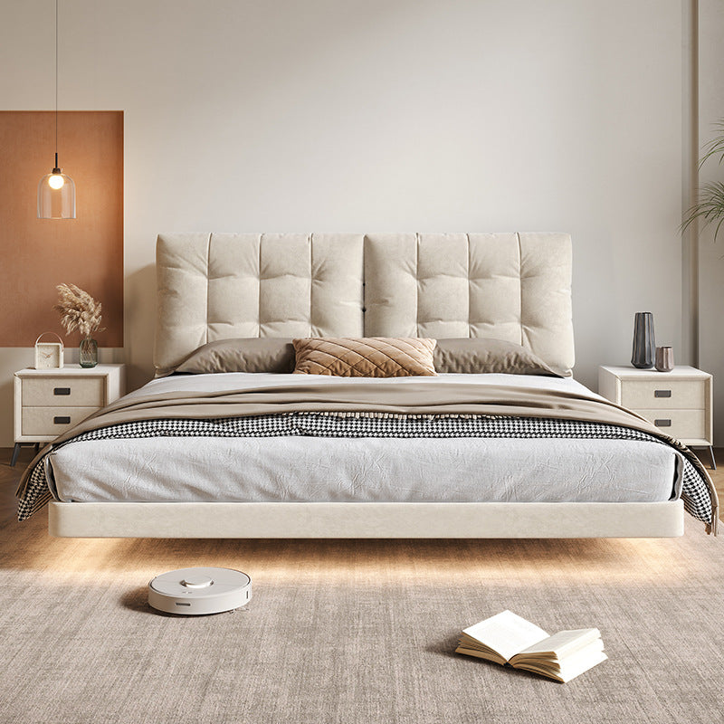 Side profile of cream floating bed in a warm neutral bedroom