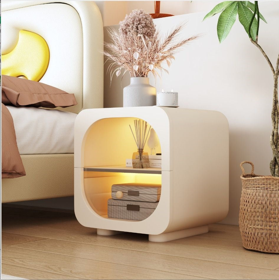 Cream bedside table with compact proportions for tidy apartment layouts
