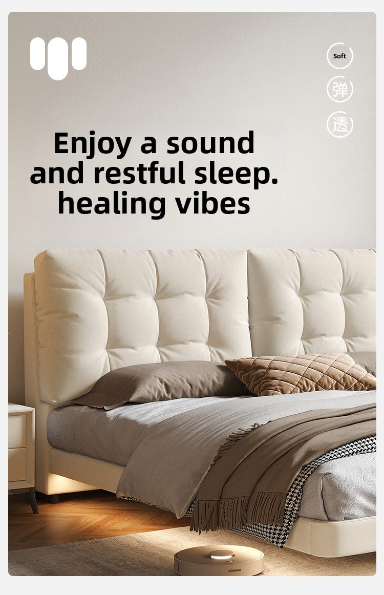 Cream upholstered floating bed in a clean apartment bedroom