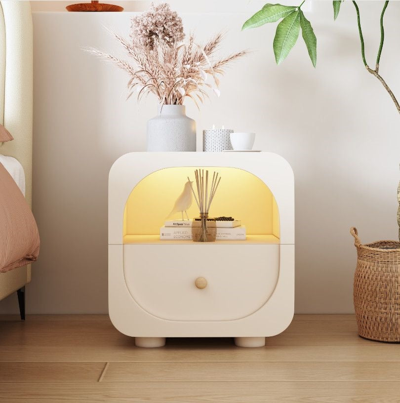 Compact bedside table in cream finish with clean soft-edged detailing