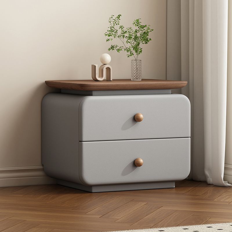 Soft beige bedside table with upholstered finish and wood drawer