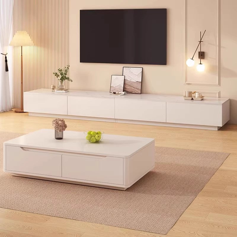 Low-profile cream media console styled in a bright apartment living room