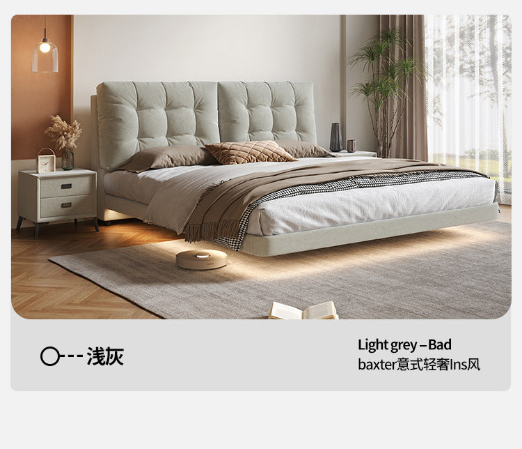 Contemporary upholstered storage bed with warm bedroom styling