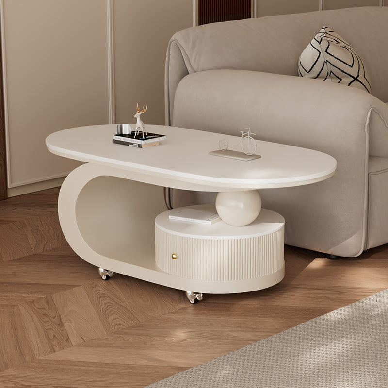 Oval cream coffee table with slate-look top in a modern living room